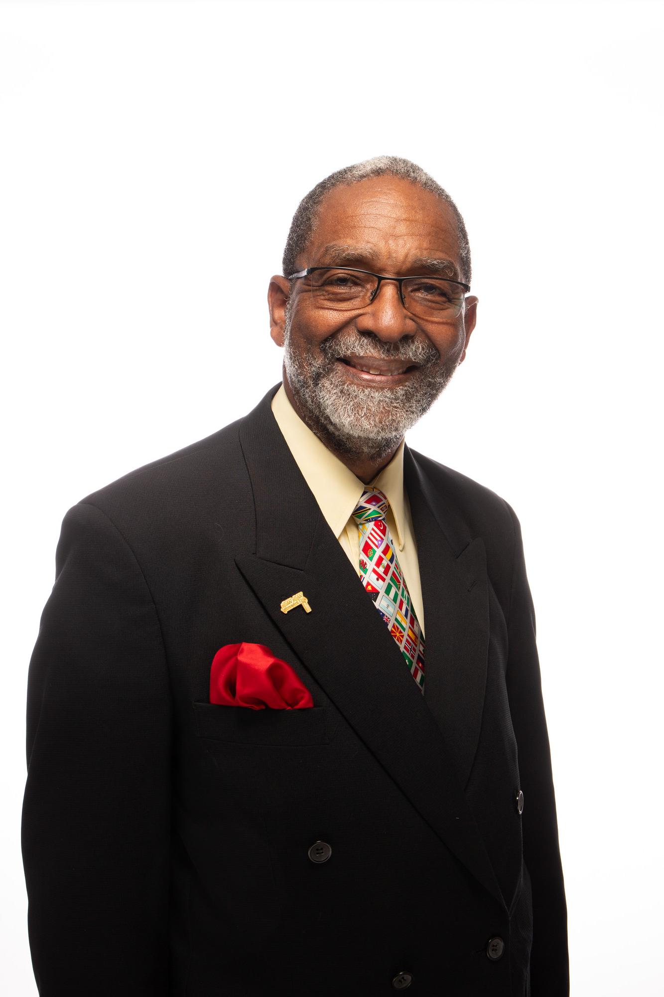 Headshot photo of Pedrito Maynard-Reid against a white background